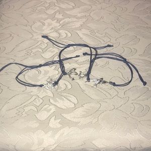 Anchor, bird, and wheel bracelets